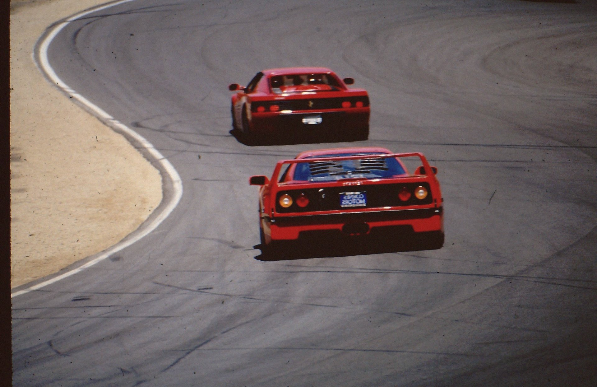 Ferrari F40 leading another Ferrari through the corner